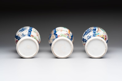 Three Chinese famille rose 'mandarin subject' vases and covers, Qianlong