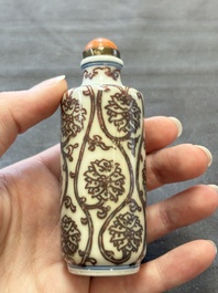 Two Chinese blue, white and copper-red snuff bottles and two blue and white snuff bottles, 19th C.