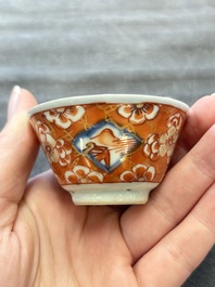 Eight Chinese blue, white and iron-red cups and twelve saucers, Kangxi/Yongzheng