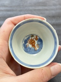 Eight Chinese blue, white and iron-red cups and twelve saucers, Kangxi/Yongzheng