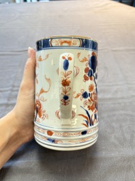 A Chinese blue and white jug and an Imari-style tankard, Transitional period/Kangxi