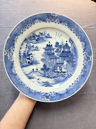 Six Chinese blue and white plates and a dish with landscape design, 18th C.