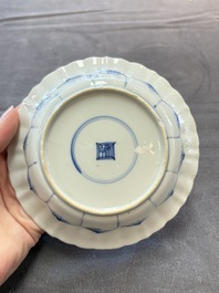 Eight Chinese blue, white and iron-red cups and twelve saucers, Kangxi/Yongzheng