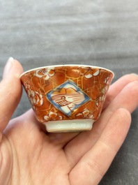 Eight Chinese blue, white and iron-red cups and twelve saucers, Kangxi/Yongzheng