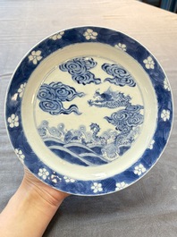 A pair of Chinese blue and white 'dragon' plates, Kangxi mark and of the period