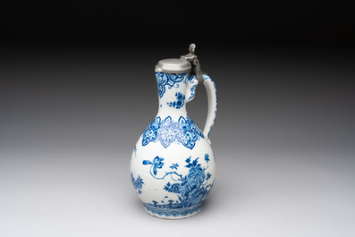 A fine blue and white Dutch Delft jug with pewter cover, early 18th C.