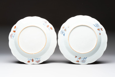 A pair of Chinese famille rose 'tobacco leaf' plates and a saucer, Qianlong