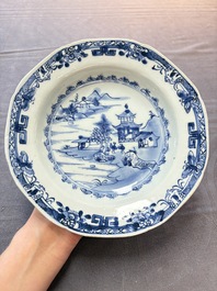 Six Chinese blue and white plates and a dish with landscape design, 18th C.