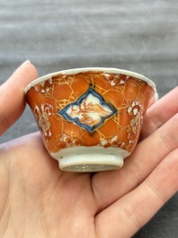 Eight Chinese blue, white and iron-red cups and twelve saucers, Kangxi/Yongzheng