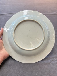 Six Chinese blue and white plates and a dish with landscape design, 18th C.