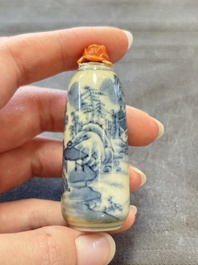 Two Chinese blue, white and copper-red snuff bottles and two blue and white snuff bottles, 19th C.