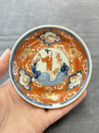 Eight Chinese blue, white and iron-red cups and twelve saucers, Kangxi/Yongzheng