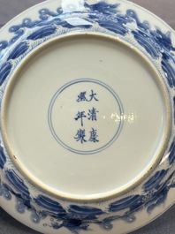 A pair of Chinese blue and white 'dragon' plates, Kangxi mark and of the period