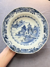 Six Chinese blue and white plates and a dish with landscape design, 18th C.