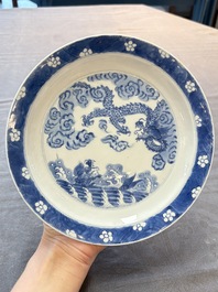 A pair of Chinese blue and white 'dragon' plates, Kangxi mark and of the period