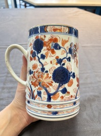 A Chinese blue and white jug and an Imari-style tankard, Transitional period/Kangxi