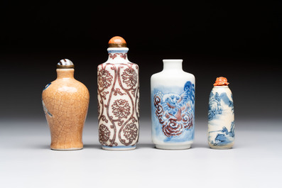 Two Chinese blue, white and copper-red snuff bottles and two blue and white snuff bottles, 19th C.