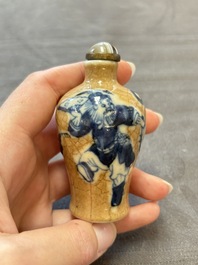 Two Chinese blue, white and copper-red snuff bottles and two blue and white snuff bottles, 19th C.