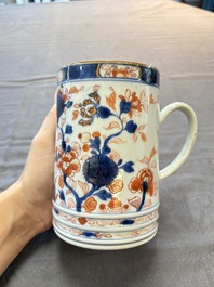 A Chinese blue and white jug and an Imari-style tankard, Transitional period/Kangxi