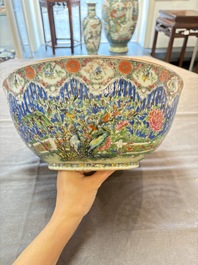 A Chinese Canton famille rose 'peacock' punch bowl, 19th C.
