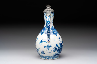 A fine blue and white Dutch Delft jug with pewter cover, early 18th C.