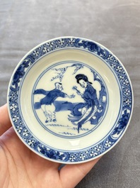 Eight Chinese blue, white and iron-red cups and twelve saucers, Kangxi/Yongzheng