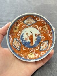 Eight Chinese blue, white and iron-red cups and twelve saucers, Kangxi/Yongzheng