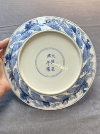 A pair of Chinese blue and white 'dragon' plates, Kangxi mark and of the period
