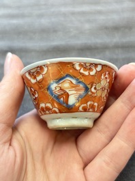 Eight Chinese blue, white and iron-red cups and twelve saucers, Kangxi/Yongzheng