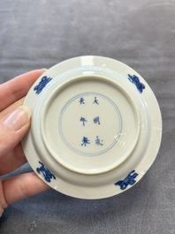 Eight Chinese blue, white and iron-red cups and twelve saucers, Kangxi/Yongzheng