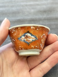 Eight Chinese blue, white and iron-red cups and twelve saucers, Kangxi/Yongzheng