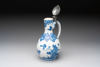 A fine blue and white Dutch Delft jug with pewter cover, early 18th C.