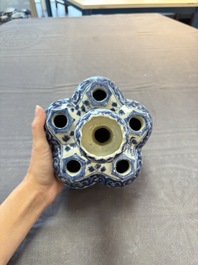 A Chinese blue and white tulip vase with floral design, 19th C.
