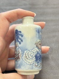 Two Chinese blue, white and copper-red snuff bottles and two blue and white snuff bottles, 19th C.