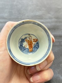 Eight Chinese blue, white and iron-red cups and twelve saucers, Kangxi/Yongzheng