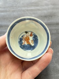 Eight Chinese blue, white and iron-red cups and twelve saucers, Kangxi/Yongzheng