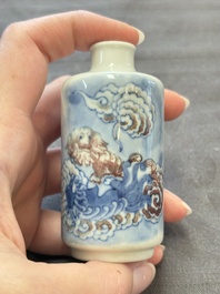 Two Chinese blue, white and copper-red snuff bottles and two blue and white snuff bottles, 19th C.