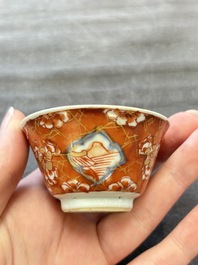 Eight Chinese blue, white and iron-red cups and twelve saucers, Kangxi/Yongzheng
