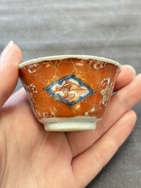 Eight Chinese blue, white and iron-red cups and twelve saucers, Kangxi/Yongzheng