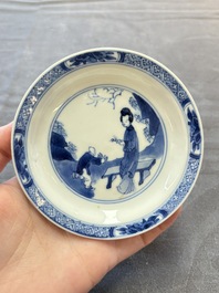 Eight Chinese blue, white and iron-red cups and twelve saucers, Kangxi/Yongzheng