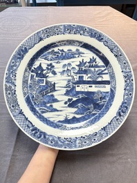 Six Chinese blue and white plates and a dish with landscape design, 18th C.