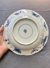 Six Chinese blue and white plates and a dish with landscape design, 18th C.