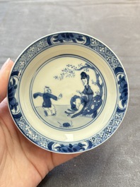 Eight Chinese blue, white and iron-red cups and twelve saucers, Kangxi/Yongzheng