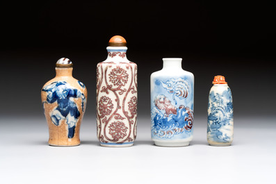 Two Chinese blue, white and copper-red snuff bottles and two blue and white snuff bottles, 19th C.