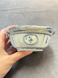 Five Chinese blue and white 'klapmuts' bowls with figural design, Wanli