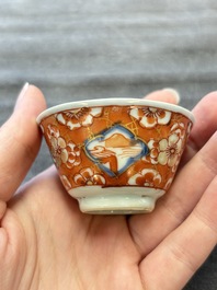 Eight Chinese blue, white and iron-red cups and twelve saucers, Kangxi/Yongzheng