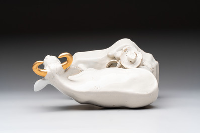 A white Dutch Delft cow milker group and a polychrome Dutch Delft parrot, 18/19th C.