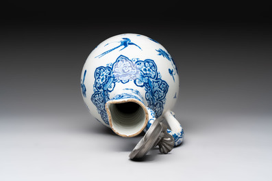 A fine blue and white Dutch Delft jug with pewter cover, early 18th C.