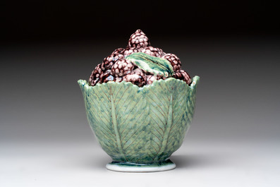 A polychrome Dutch Delft 'mulberries' tureen and cover on stand, 18th C.