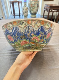 A Chinese Canton famille rose 'peacock' punch bowl, 19th C.